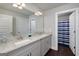 Well-lit bathroom with double vanity featuring granite countertop, plenty of storage, and a shower/tub combo at 433 Wilson Dr, Mcdonough, GA 30252