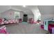 Bright bedroom features two windows and plenty of room for to play at 433 Wilson Dr, Mcdonough, GA 30252