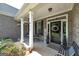 Charming front porch with decorative seating, plants, and welcoming decor. The house number is clearly visible at 433 Wilson Dr, Mcdonough, GA 30252