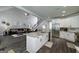 Spacious kitchen with granite island, stainless steel appliances, and open-concept layout flowing into the living room at 433 Wilson Dr, Mcdonough, GA 30252