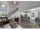 Open-concept living area featuring a staircase, dining area, kitchen with barstool seating, and living room at 433 Wilson Dr, Mcdonough, GA 30252