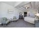 Comfortable main bedroom boasts a decorative tray ceiling, neutral colors and sitting area at 433 Wilson Dr, Mcdonough, GA 30252