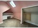 Attic space featuring built-in desk and closet with sloped ceilings at 435 Jackson St, Locust Grove, GA 30248