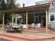 Expansive deck featuring an outdoor dining area and comfortable seating for entertaining or relaxation at 435 Jackson St, Locust Grove, GA 30248