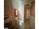 Bathroom shows potential with its fixtures, despite needing updates and repairs at 435 Jackson St, Locust Grove, GA 30248