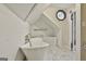 Elegant bathroom featuring a freestanding tub, tiled floors, natural light, and vintage fixtures at 435 Jackson St, Locust Grove, GA 30248