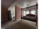 Bedroom with four-poster bed frame, original hardwood floors, and natural light at 435 Jackson St, Locust Grove, GA 30248