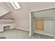 Cozy bedroom with closet, skylight, built-in desk and shelving, and plush carpeting at 435 Jackson St, Locust Grove, GA 30248