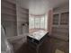 Bedroom with built-in shelving and bay window features lots of natural light at 435 Jackson St, Locust Grove, GA 30248
