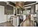 Bright kitchen boasts a central island, gas range, and plenty of space for cooking and entertaining at 435 Jackson St, Locust Grove, GA 30248