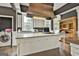 A kitchen featuring granite countertops, a copper range hood, an island, and stainless-steel appliances at 435 Jackson St, Locust Grove, GA 30248