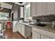 Well-lit kitchen featuring granite countertops, modern appliances, and ample cabinet space for a contemporary feel at 435 Jackson St, Locust Grove, GA 30248