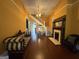 Spacious living room with hardwood floors, a staircase, and a fireplace at 435 Jackson St, Locust Grove, GA 30248
