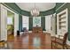 A living room showcasing beautiful trim work, hardwood floors, and abundant natural light at 435 Jackson St, Locust Grove, GA 30248