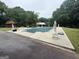 Inviting pool area adorned with statues, offering a serene outdoor retreat and recreational space at 435 Jackson St, Locust Grove, GA 30248