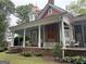 Spacious porch with seating area, perfect for relaxing and enjoying the serene surroundings at 435 Jackson St, Locust Grove, GA 30248