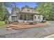 Charming home featuring a large wooden deck perfect for outdoor gatherings and enjoying the spacious yard at 435 Jackson St, Locust Grove, GA 30248