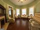 Bright sitting room featuring hardwood floors and large bay windows at 435 Jackson St, Locust Grove, GA 30248