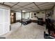 Finished basement with drop ceiling, bedroom area, entertainment area, and laundry room access at 639 Sheffield Ct, Villa Rica, GA 30180