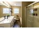 Bright bathroom with double vanity, tub and shower combination, and modern fixtures at 639 Sheffield Ct, Villa Rica, GA 30180