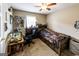 Cozy carpeted bedroom with a ceiling fan, wooden bed frame, and desk area at 639 Sheffield Ct, Villa Rica, GA 30180