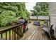 Well-maintained deck with a grill, patio seating, and lovely views of the lush backyard at 639 Sheffield Ct, Villa Rica, GA 30180