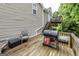 Outdoor deck space with grill, seating, and wooded views, perfect for entertaining at 639 Sheffield Ct, Villa Rica, GA 30180