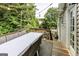 Spacious backyard deck with a dining table and string lights, ideal for outdoor dining at 639 Sheffield Ct, Villa Rica, GA 30180