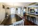 Dining room and kitchen view with breakfast bar seating and backyard access at 639 Sheffield Ct, Villa Rica, GA 30180