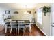 Inviting dining room area with natural light, a modern chandelier, and stylish decor at 639 Sheffield Ct, Villa Rica, GA 30180