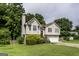 Charming two-story home with well-maintained lawn, mature trees, and a two-car garage at 639 Sheffield Ct, Villa Rica, GA 30180