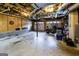 Large garage with multiple car doors, concrete floor, exposed ceiling and utility access at 639 Sheffield Ct, Villa Rica, GA 30180