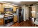 Well-equipped kitchen with stainless steel appliances, wooden cabinets and stylish tile backsplash at 639 Sheffield Ct, Villa Rica, GA 30180