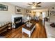 Inviting living area with fireplace, lots of natural light, and wood-look floors at 639 Sheffield Ct, Villa Rica, GA 30180