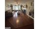 Spacious living room with hardwood floors, a cozy fireplace, and an abundance of natural light at 639 Sheffield Ct, Villa Rica, GA 30180