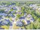 Residential neighborhood showcasing tree-lined streets and various home styles with solar panels at 100 Harmony Ct, Dallas, GA 30157