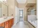Bathroom with double vanity, tile flooring, and separate tub and shower at 100 Harmony Ct, Dallas, GA 30157