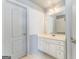 Bathroom with white vanity, gray-and-white walls, and a framed mirror over the sink at 100 Harmony Ct, Dallas, GA 30157