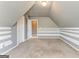 Neutral bonus room with carpet floors, wainscoting and multiple doors for easy access at 100 Harmony Ct, Dallas, GA 30157