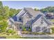 Beautiful two-story home featuring manicured landscaping, stone accents, and a classic architectural design at 100 Harmony Ct, Dallas, GA 30157