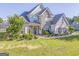 Beautiful two-story home with stone accents and well-manicured landscaping at 100 Harmony Ct, Dallas, GA 30157