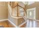 Inviting foyer with hardwood floors and a staircase with wood and white railings at 100 Harmony Ct, Dallas, GA 30157