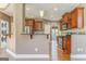 Well-designed kitchen with stainless steel appliances, dark cabinets, and an open layout to other living spaces at 100 Harmony Ct, Dallas, GA 30157