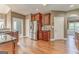 Kitchen featuring a stainless steel refrigerator, dark wood cabinets, and granite countertops at 100 Harmony Ct, Dallas, GA 30157
