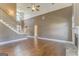 Spacious living area featuring high ceilings, hardwood floors, fireplace, and plenty of natural light at 100 Harmony Ct, Dallas, GA 30157