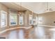 Bright living room with a stone fireplace and many windows for natural light and hardwood floors at 100 Harmony Ct, Dallas, GA 30157