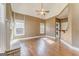Inviting living room with vaulted ceilings, hardwood floors, fireplace, and large windows at 100 Harmony Ct, Dallas, GA 30157