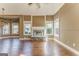 Bright living room with hardwood floors, stone fireplace, and large windows at 100 Harmony Ct, Dallas, GA 30157