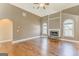 Bright living room with hardwood floors, stone fireplace, and large windows at 100 Harmony Ct, Dallas, GA 30157