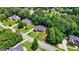 Beautiful aerial view of a traditional-style home with mature trees and a well-kept lawn in a residential neighborhood at 1621 White Oak Cv, Loganville, GA 30052